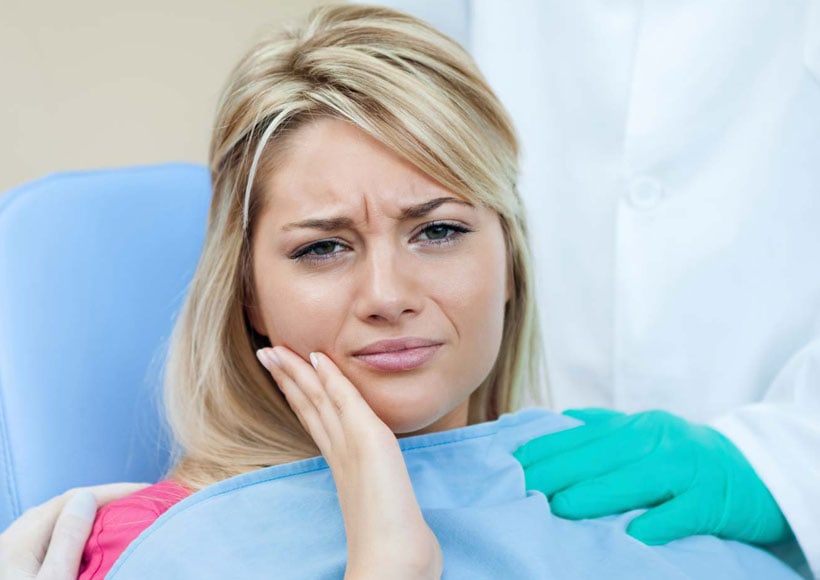 Smiling teenager — wisdom tooth removal in late teens prevents future crowding